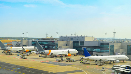 Airplanes at runway by the airport terminal, Frankfurt am Main, Germany