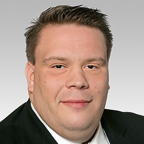 Christian Beisch Ein Portrait von einem Mann der in die Kamera lächelt